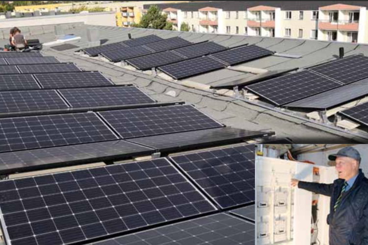 Photovoltaikanlage auf dem Dach der BWG Blankenburg – nachhaltige Stromerzeugung für Mieterstromprojekt, mit Techniker bei der Inbetriebnahme          ChatGPT fragen